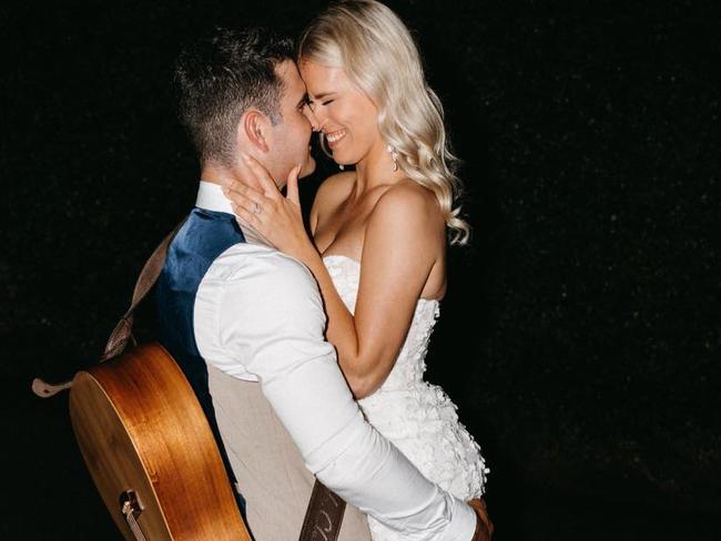 Hervey Bay wedding singer William Ramage, pictured here on his own wedding day to Hannah with his trusted guitar, has auditioned for Australian Idol. Photo: Facebook