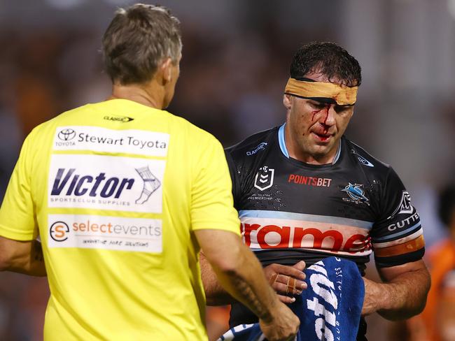 Dale Finucane of the Sharks walks off after receiving a cut. Picture: Getty Images