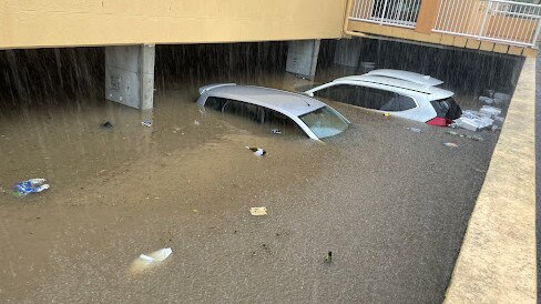 Cars underwater on Farrell Drive, Tugun.