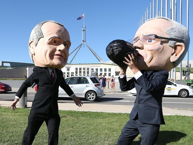 caricatures of Bill Shorten and PM Scott Morrison with people attending a Stop Adani rally on the lawns of Parliament House in Canberra. Picture Kym Smith