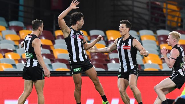 Collingwood’s Josh Daicos kicks the match-sealer against the Swans at the Gabba. Picture: Getty Images