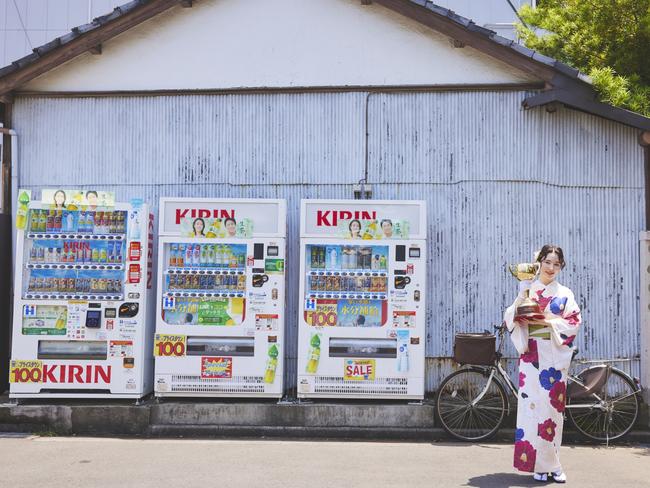 Marina with the trophy and vending machines in Asakusa, Tokyo. Picture: Shungotanaka