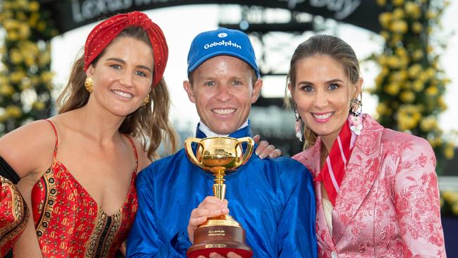 Kerrin McEvoy and his wife Cathy (right) and her sister Michelle Payne add another Melbourne Cuo to the famnily collection. Picture: Jay Town