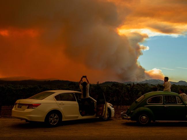 A series of massive fires in northern and central California forced more evacuations as they quickly spread darkening the skies and dangerously affecting air quality. Picture: AFP