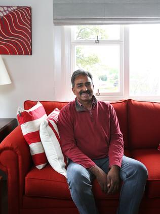 Jacob Ikareth relaxes on the couch at his West Hobart home. Picture: NIKKI DAVIS-JONES