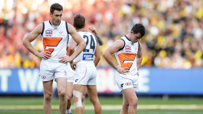 Jeremy Cameron (L) and Brent Daniels (R) of the Giants look dejected after a Tigers goal during the 2019 grand final.