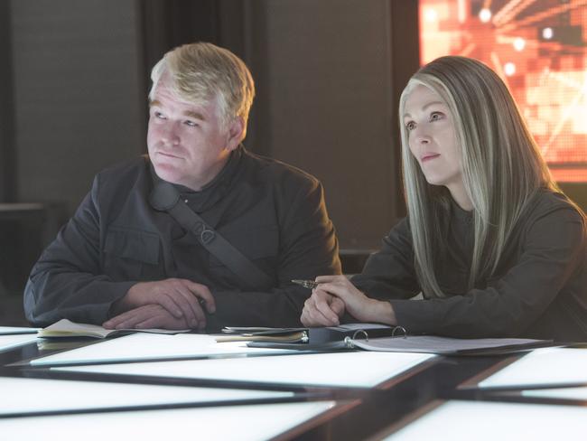 Philip Seymour Hoffman as Plutarch Heavensbee and Julianne Moore as President Coin.