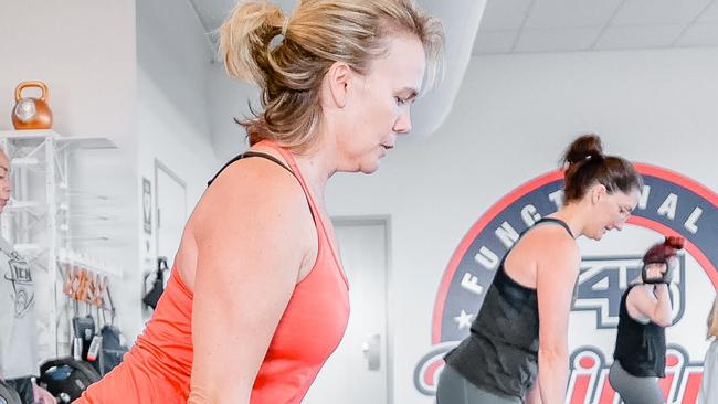 Tammy Barker and Sakeena Sheik give their all in an F45 workout. Picture: supplied.