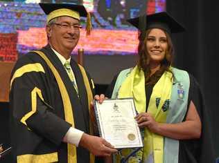 PROUD RESULT: CQUniversity Chancellor John Abbott with graduate Shae Marr. Picture: Contributed