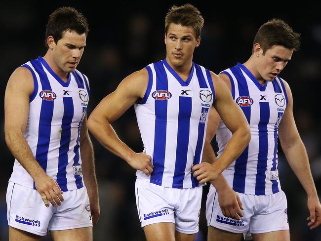 MELBOURNE, AUSTRALIA - JULY 18: Levi Greenwood (L) Andrew Swallow (c) and Ryan Bastinac of the Kangaroos walk off at half time during the round 18 AFL match between the Carlton Blues and the North Melbourne Kangaroos at Etihad Stadium on July 18, 2014 in Melbourne, Australia. (Photo by Michael Dodge/Getty Images)