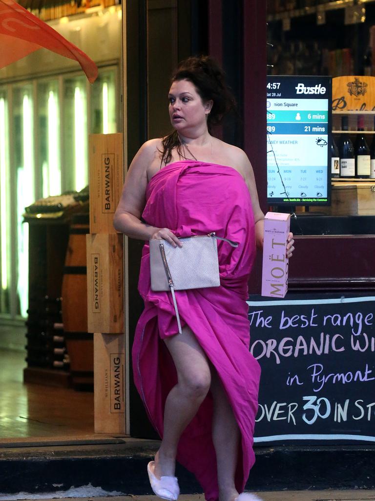 Tziporah Malkah holds a bottle of Moet as she leaves the bottle shop. Picture: DIIMEX