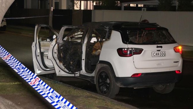 A Jeep getaway car was found on fire in nearby Five Dock after the stabbing. A gun was found in the car, which failed to fully burn. Picture: TNV