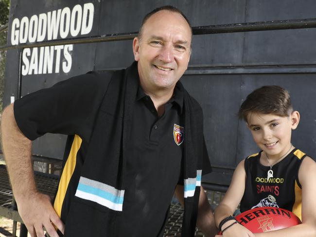 Port Adelaide media manager Daniel Norton is the new Goodwood Saints footy manager. Pictured at the Saint's home ground with 10 year old son Harrison, who plays for the Saints. 25 January 2020. (AAP Image/Dean Martin)