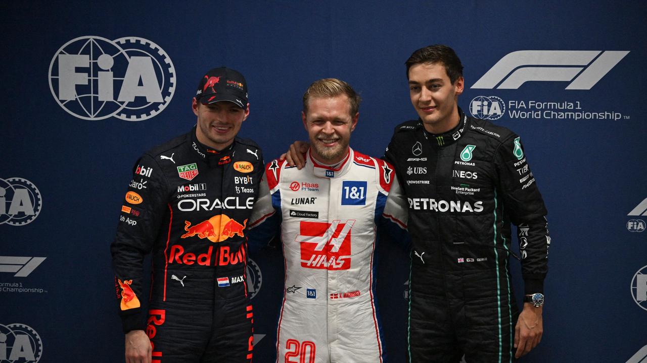 Magnussen (middle) stunned the F1 world. (Photo by NELSON ALMEIDA / POOL / AFP)