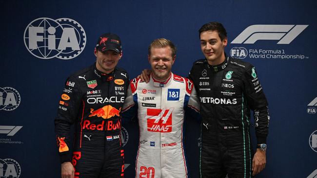 Magnussen (middle) stunned the F1 world. (Photo by NELSON ALMEIDA / POOL / AFP)