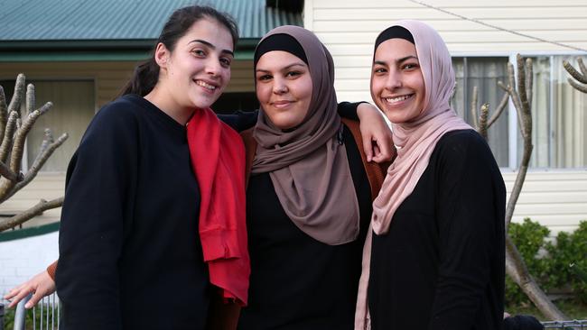 Eman Shalaby, 20, Amanda Jacobs, 20, and Batoul Al-Masri. Amanda has lived on Renown Ave for 20 years. Picture: Jonathan Ng