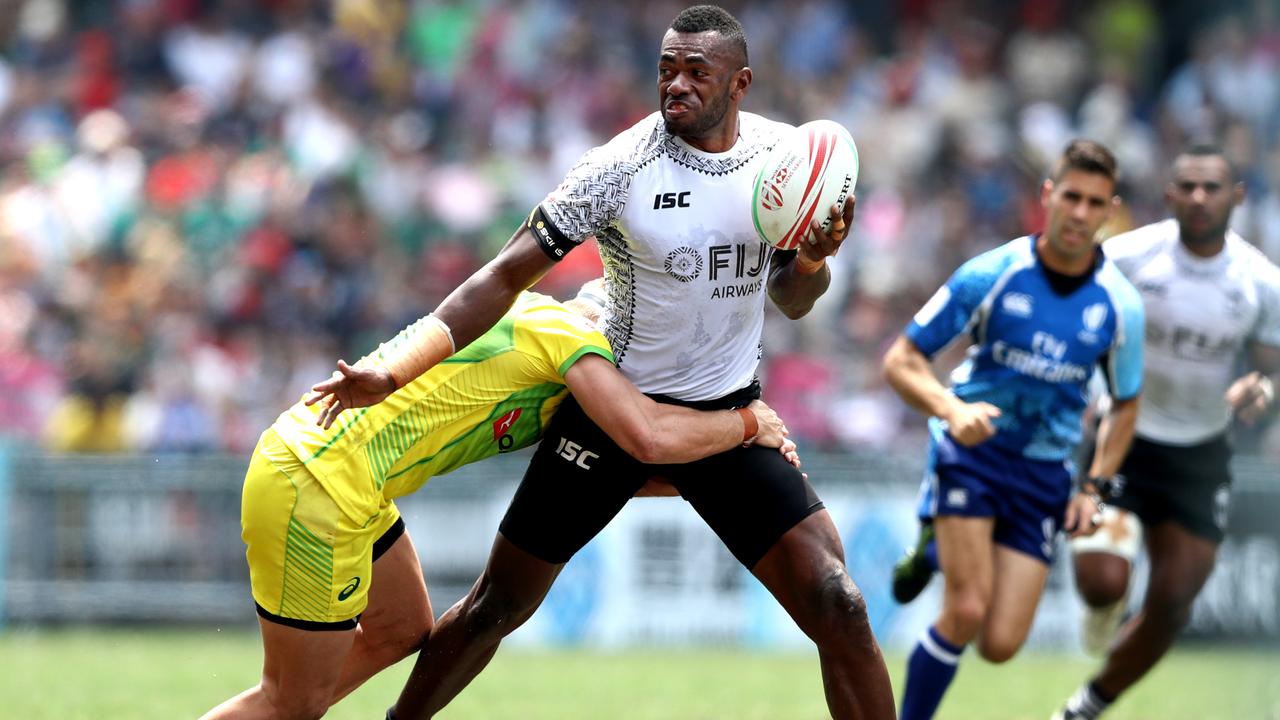 Sevuloni Mocenacagi of Fiji makes a break against Australia.