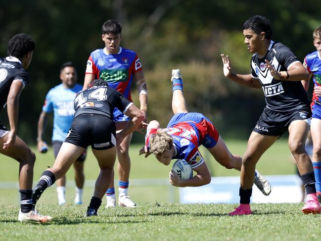 Beau Hill is tackled by Lorima Cosgrave. Picture: Michael Gorton