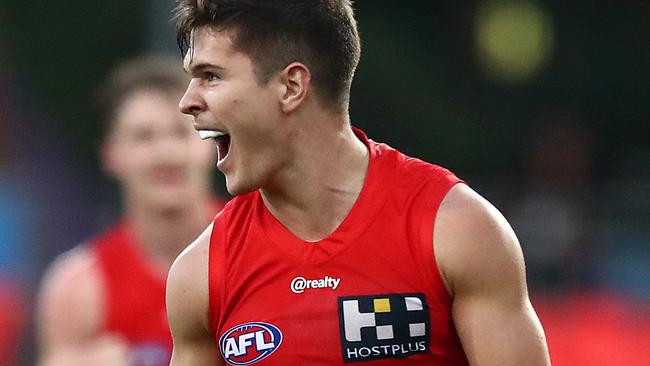 GOLD COAST, AUSTRALIA - JUNE 21: Connor Budarick of the Suns celebrates a goal during the round 3 AFL match between the Gold Coast Suns and the Adelaide Crows at Metricon Stadium on June 21, 2020 in Gold Coast, Australia. (Photo by Jono Searle/AFL Photos/via Getty Images )