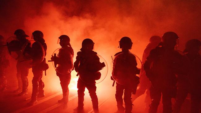 Police are out in force as A-League's fans set off flares, taunt police ahead of decider match. Picture: NewsWire / Diego Fedele