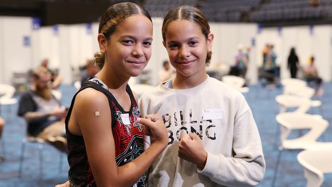 Twleve-year-old twins Shiloh and Sienna Nakachi of Kanimbla took the opportunity to get vaccinated against the Covid-19 coronavirus at the mass vaccination hub set up in the Cairns Convention Centre. Picutre: Brendan Radke