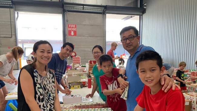 Adeline Truong and her family volunteering at one of the Sydney Basket Brigade packing days.