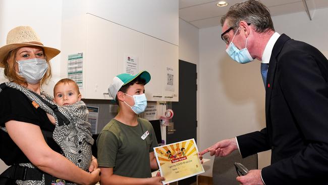 NSW Premier Dominic Perrottet congratulates a young boy after he received a Covid vaccination at the Sydney Children’s Hospital in Randwick. Picture: AAP Image/Bianca De Marchi