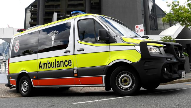 BRISBANE, AUSTRALIA - NewsWire Photos - JANUARY 13, 2021.An Ambulance leaves the Hotel Grand Chancellor in Spring Hill, Brisbane. Guests will be evacuated after six people linked to the building tested positive to the highly-contagious UK variant of the coronavirus.Picture: NCA NewsWire / Dan Peled