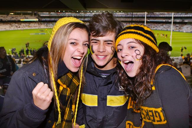 Tigers fans Sophie, Jed and Grace travelled from Traralgon for the traditional season opener against Carlton.