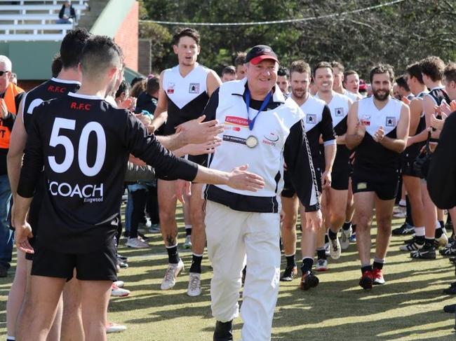 Ringwood players form a guard of honour for head trainer Ian Barnes, who celebrated his 50th year at the Eastern Football League club. Picture: Teagan Cairns