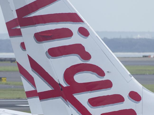 SYDNEY, AUSTRALIA - NewsWire Photos FEBRUARY 06, 2021: A general view of the tails of Virgin Australia planes at Sydney Domestic airport.  Picture: NCA NewsWire / Jenny Evans