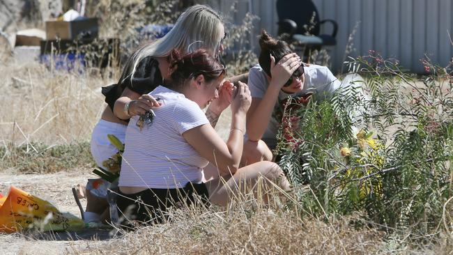 Mourners united in grief at the scene of a fatal crash at Dalkieth in 2021. Picture: Emma Brasier