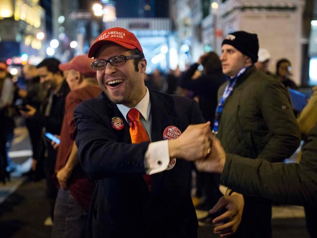 A supporter of Republican presidential nominee Donald Trump reacts to updates from the election returns outside Trump Tower in New York City. Picture: AFP/Dominick Reuter