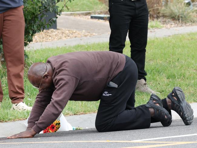 The father of Nathan Mwanza arrives at the scene of his son’s fatal stabbing. Picture: David Crosling