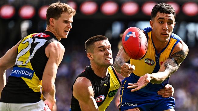 PERTH, AUSTRALIA - APRIL 14: Tyler Brockman of the Eagles handpasses the ball during the 2024 AFL Round 05 match between the West Coast Eagles and the Richmond Tigers at Optus Stadium on April 14, 2024 in Perth, Australia. (Photo by Daniel Carson/AFL Photos via Getty Images)