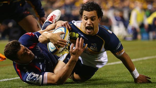 CANBERRA, AUSTRALIA - MAY 31: Matt Toomua of the Brumbies scores a try during the round 16 Super Rugby match between the Brumbies and the Rebels at Canberra Stadium on May 31, 2014 in Canberra, Australia. (Photo by Mark Nolan/Getty Images)