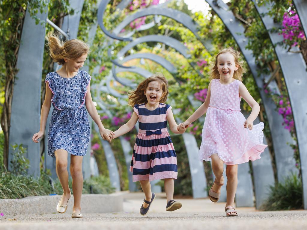 Sisters Isabella, 10, Hannah, 4, and Charlotte, 7, in South Bank’s Grand Arbour, which would be extended to 5km under the Brisbane 2032 vision. Picture: Lachie Millard