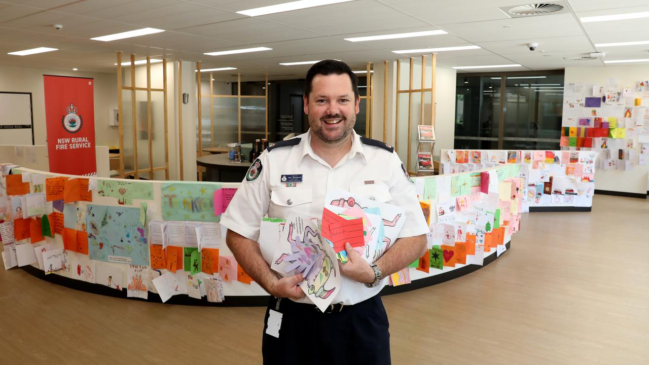 RFS Media and Communications manager Ben Shepherd with ‘thank you’ cards from kids across NSW, during the fires of 2019-2020. Picture: Damian Shaw