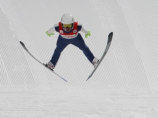 ZHANGJIAKOU, CHINA - DECEMBER 04:  Zhen Weijie of China competes in the Men's Large Hill Individual final of the 2021/2022 FIS Ski Jumping Continental Cup, a test event for the Beijing 2022 Winter Olympics at National Ski Jumping Centre on December 4, 2021 in Zhangjiakou, China.  (Photo by Lintao Zhang/Getty Images)