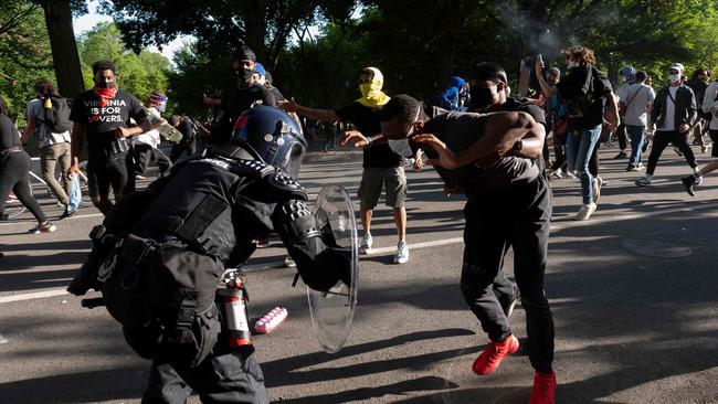 Riot police clash with protesters near the White House. Picture: AFP