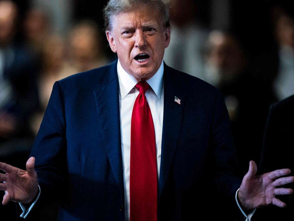 Donald Trump speaks to the press as he arrives for the first day of his trial. Picture: AFP