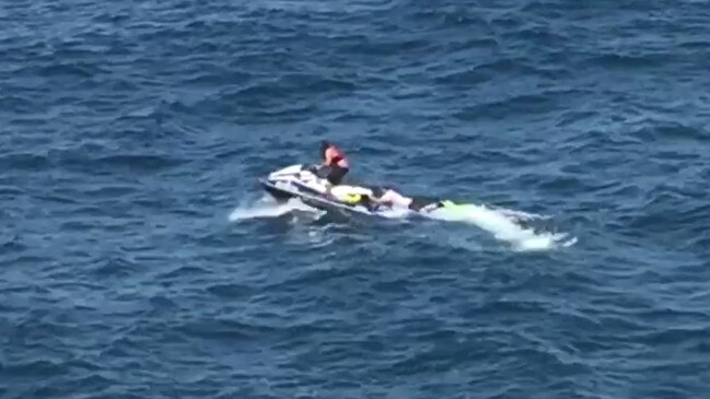 A swimmer is rescued by a jet skier near the Kiama blowhole. Picture: Anita Balalovski