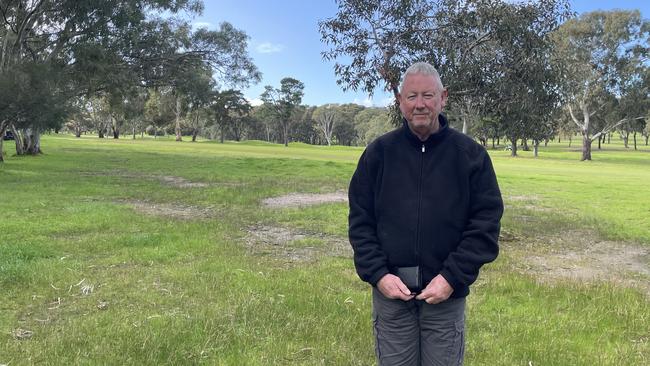 Paul Jay stands at his fence line which could soon become the land for 60, two-storey homes.