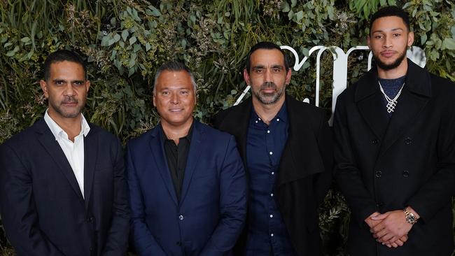 Simmons, right, with O'Loughlin, Stan Grant and Adam Goodes last night. Picture: Stefan Postles/AAP