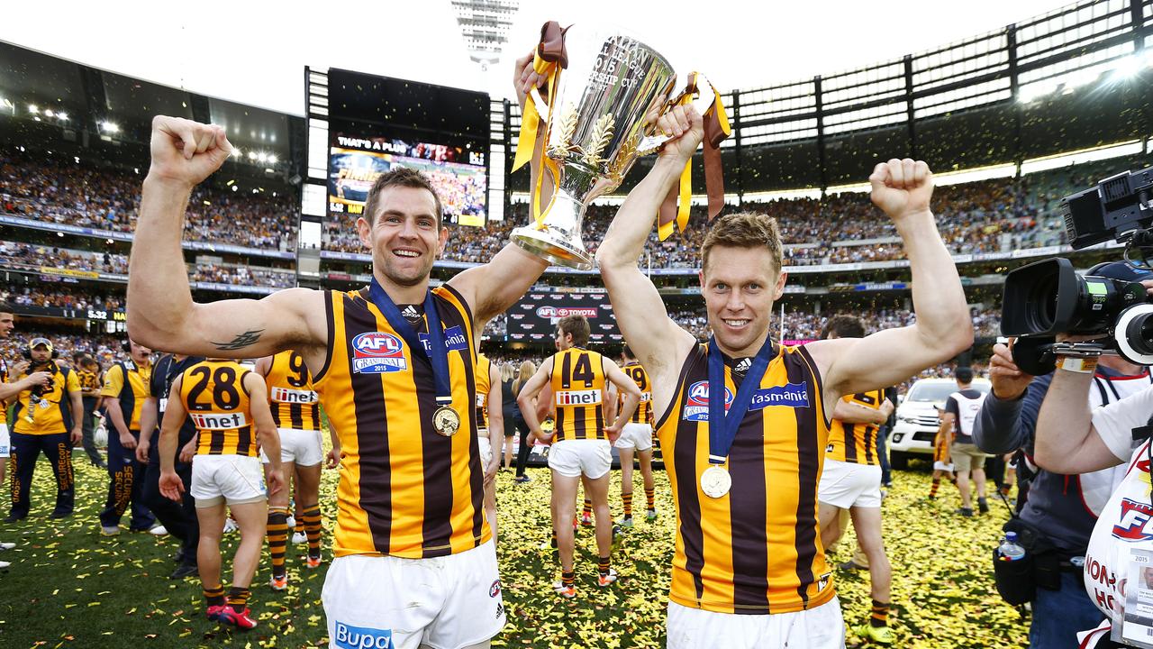 Luke Hodge and Sam Mitchell after winning the 2015 Grand Final. Picture: Michael Klein