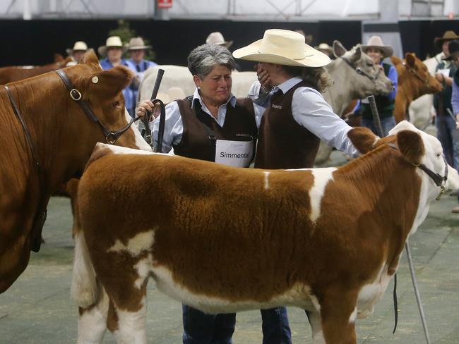 Rita Canning and her daughter Ruby shed a few tears as their Simmental heifer was announced interbreed champion. Picture: Yuri Kouzmin.