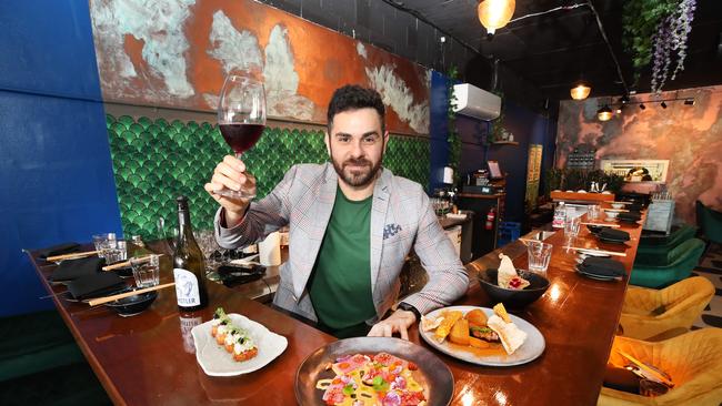 Tayta Nikkei is a new Peruvian and Japanese restaurant in the Nobbys precinct. Owner Adriano Antonini toasts to the success of his new restaurant... Picture Glenn Hampson