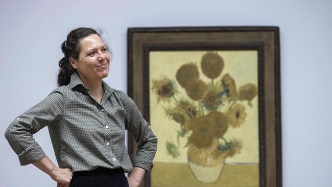 NGA co-ordinating curator Sally Foster with van Gogh's famous painting, Sunflowers 1888. Picture: NCA NewsWire/Gary Ramage.