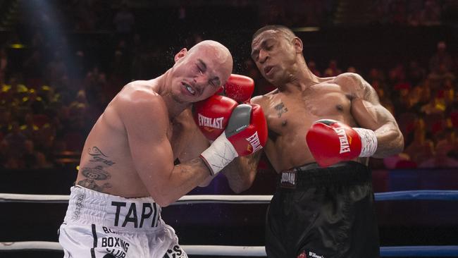 Renold Quinlan (right) in a professional fight in 2019. Picture: Craig Golding