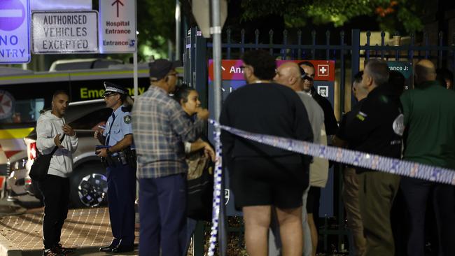 Concerned people outside Liverpool Hospital which is in lockdown after Bishop Mar Mari Emmanuel was stabbed as he delivered mass at Christ The Good Shepherd Church. Picture: NCA NewsWire / Jonathan Ng